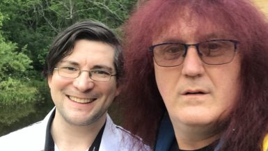 Warren Lapine, wine blogger and book publisher, has long hair and wears flashy shirts; he looks like a rock star. Will May, wine blogger and sommelier, has short hair, wears glasses, and is a dapper dresser. He looks a bit like Clark Kent.