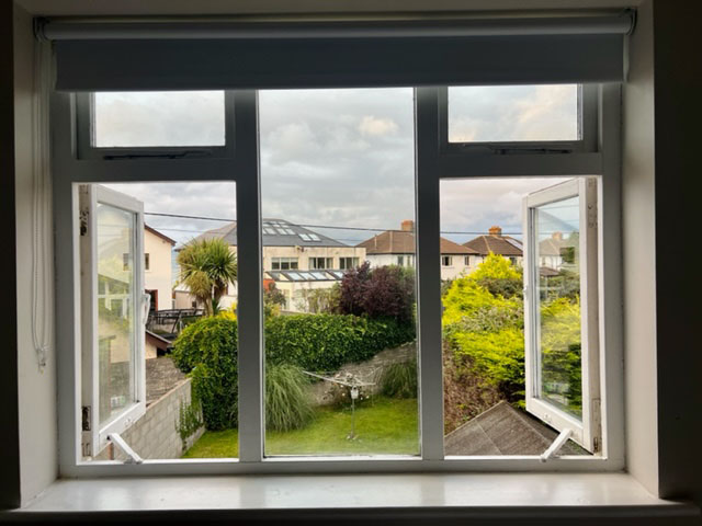 View of Irish houses through an open window.