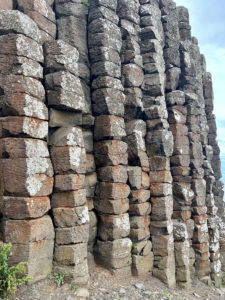 Naturally formed stacks of hexagonal stones form a wall at the Giants Causeway.