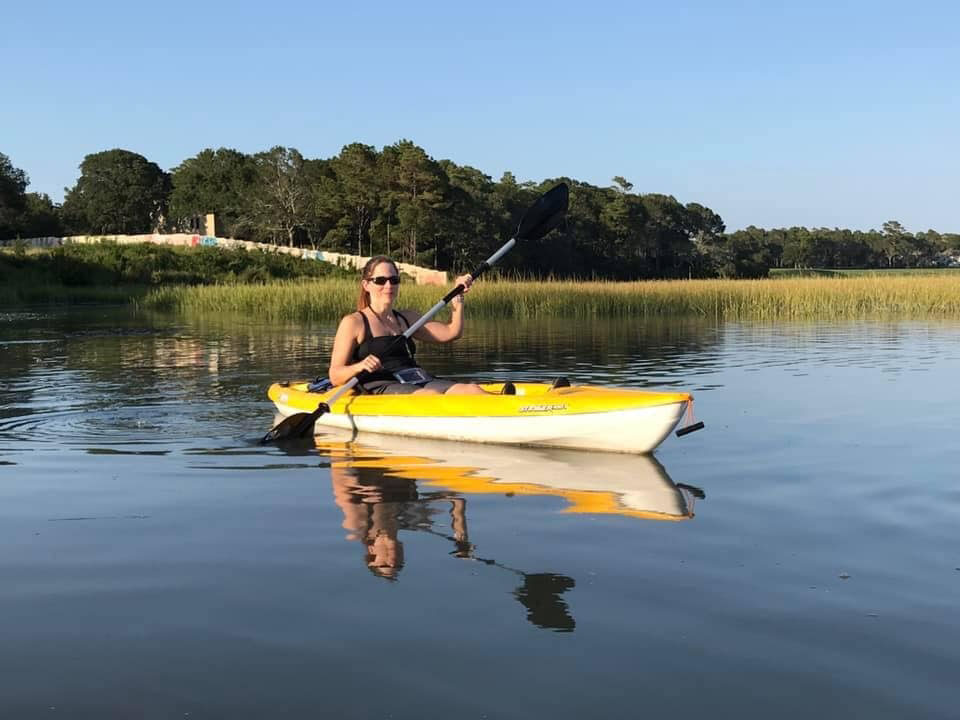 A woman paddling a kayak